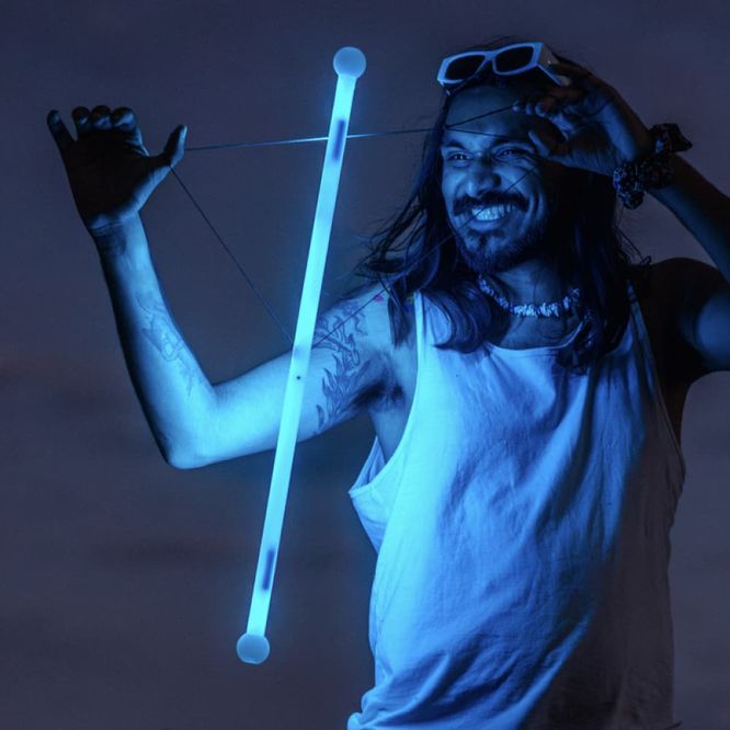 Mustafa illuminated by the blue glow of a MoodHoops wand